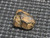 Uraninite - Deer Park Mine, North Carolina, USA - 1.4 Grams under indoor light