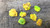 7 Piece Autunite Lot under outdoor light demonstrating daytime fluorescence