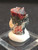 Zircon double crystal in perky box on display under indoor light