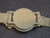 Model 1949 Wrist Compass under indoor light bottom view