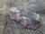 black bubbly botryoidal uraninite ON MATRIX under outdoor light