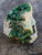 Green flaky Torbernite on Matrix under outdoor light