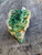 Green flaky Torbernite on Matrix under outdoor light