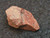 reddish-brown monazite-(Ce) under indoor light