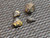 4 piece black uraninite specimens under indoor light