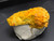 Yellow-orange curite under indoor light