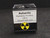 bottom view of labeled perky box with round black and yellow trefoil symbol
