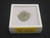 showing how the specimen is stored in a labeled display case and radioactive warning tape - top view
