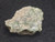 vitreous looking 3.2 gram trinitite specimen under in door light