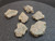 vitreous 13.4 gram trinitite lot o 6 pieces on display under indoor light