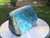 polished blue apatite crystal sculpture under outdoor light