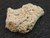 This vitreous looking 4.1 gram trinitite specimen under indoor light bottom view