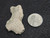 This vitreous looking trinitite specimen size comparison to steel penny top view
