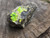 Bright yellow/green autunite crystals o matrix demonstrating daytime fluorescence under outdoor light
