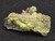 drab green and yellowish /white  Andersonite, Schröckingerite, Metamunirite on a sandstone matrix under indoor light
