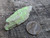 bright yellow/green Andersonite, Schröckingerite, Metamunirite on sandstone matrix under outdoor light size comparison to copper penny top view
