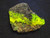 The larger specimen under indoor and 365nm light showing bright yellow fluorescence