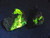pair of specimens showing bright yellow Bayleyite on Matrix under 365nm light