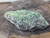 bright green Andersonite & dark green Schröckingerite on Sandstone under outdoor light