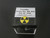showing how this specimen is stored and shipped in a cube shaped labeled perky box with yellow and black round trefoil symbol