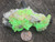 light green hyalite opal under outdoor light size comparison to copper penny top view