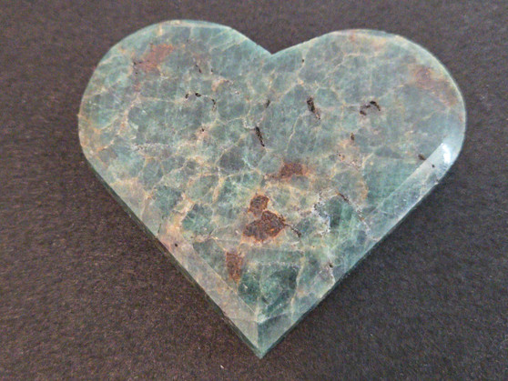 carved Blue Apatite Crystal under indoor light