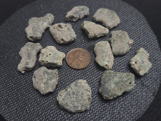 13-piece Trinitite lot - 30 grams size comparison to copper penny top