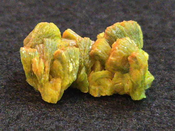 4 Gram Autunite Crystal on display under indoor light
