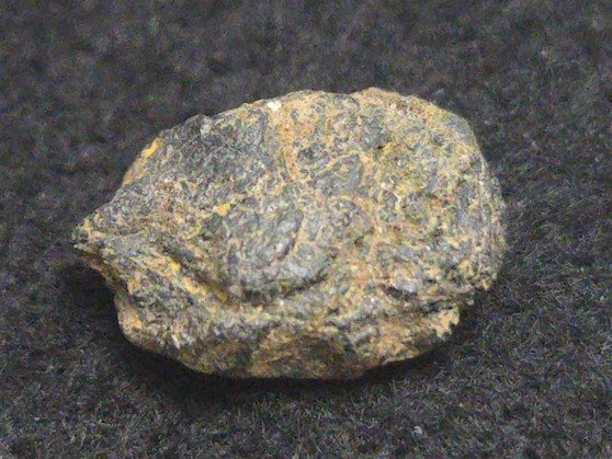 Uraninite - Deer Park Mine, North Carolina, USA - 2.1 Grams under indoor light