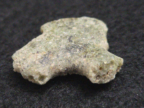 1.1 Gram Trinitite sample displayed under indoor light