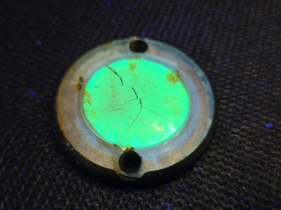 Luminous Paratrooper Marker Disc under 365nm UV light