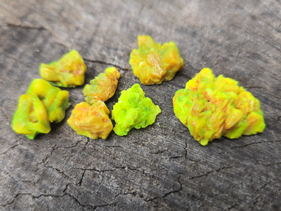 7 Piece Autunite Lot under outdoor light demonstrating daytime fluorescence