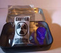 showing how product is shipped in a labeled metal tin with a single free UV light source