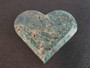 carved Blue Apatite Crystal under indoor light