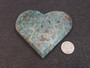 carved Blue Apatite Crystal under indoor light - size comparison to penny top view