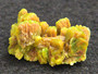 4 Gram Autunite Crystal on display under indoor light