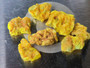 7 Piece Autunite Lot displayed on watch glass under outdoor light