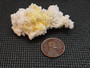 Boltwoodite on Botryoidal Gypsum Matrix under indoor light size comparison to copper penny top view