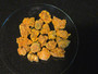 25 Grams of Autunite Fragments under normal light