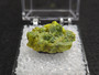 3.6 Gram Autunite Crystal in Perky Box  under indoor light