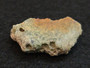 2.7 Gram Trinitite (Atomic Bomb Glass) specimen with red tinge under indoor light