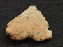 1.7 gram Trinitite (Atomic Bomb Glass) specimen under indoor light