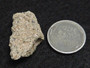 2.5 Gram Trinitite (Atomic Bomb Glass) specimen under indoor light size comparison to steel penny bottom view