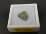showing how Trinitite (Atomic Bomb Glass), 790 Milligrams is stored in labeled display case front view