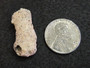 Trinitite (Atomic Bomb Glass), Trinity Site, New Mexico, July 16, 1945 - under indoor light size comparison to steel penny top view