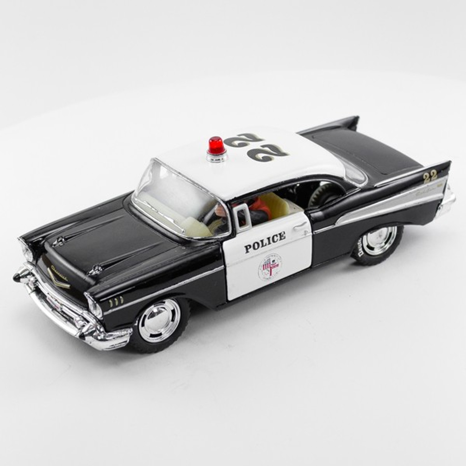 Stock Number 16173: Black Police Car 57 Chev by SCX