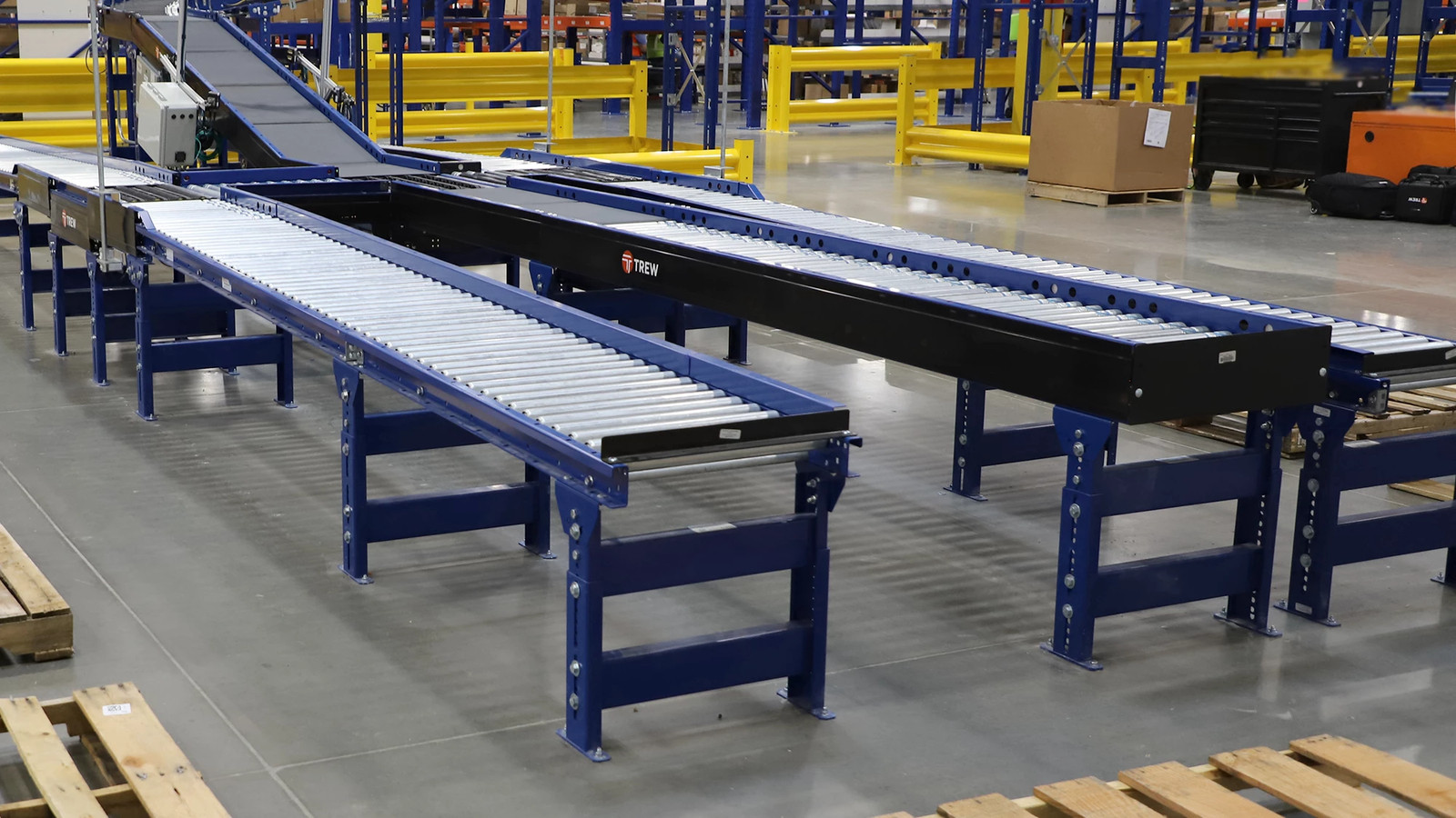 Three MDR conveyors lined up in a warehouse operation