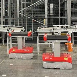 Robotic sorters from Addverb stand ready near conveyor systems