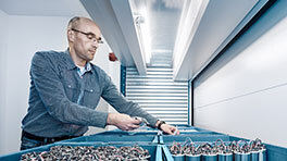 Employee picks parts from Kardex VLM
