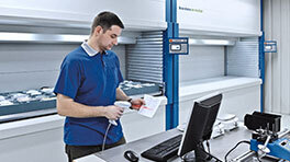 Employee uses software integrated with Kardex VLMs